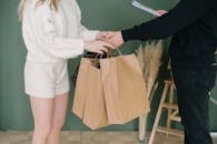 Two People Holding Shopping Bags