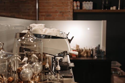 A cozy coffee shop interior featuring a modern espresso machine and various coffee accessories.