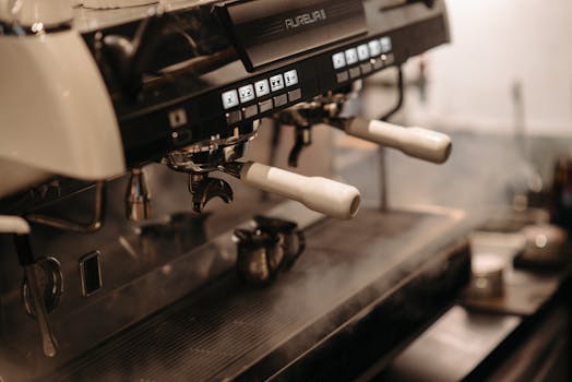 Close-up of a professional espresso machine in a cafe, showcasing sleek design and controls.