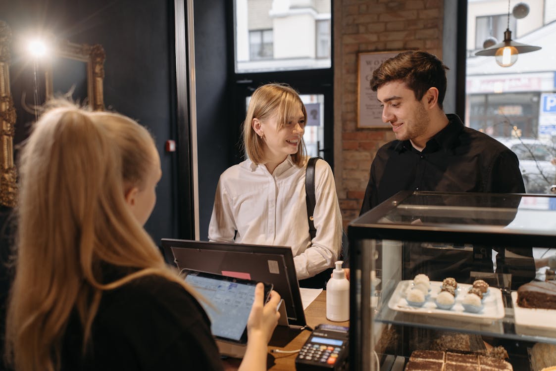Free Customers Placing an Order in the Counter Stock Photo