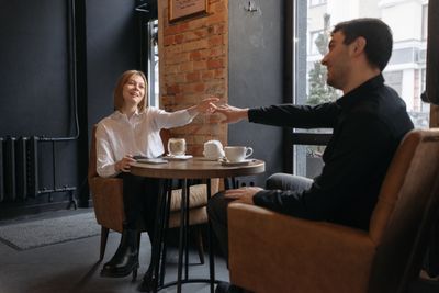 Online dating Luxembourg — couple connecting over coffee on AimerWorld