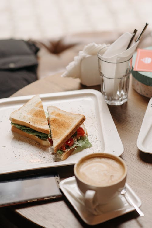 Free A Cup of Coffee and a Toasted Sandwich on a Tray Stock Photo