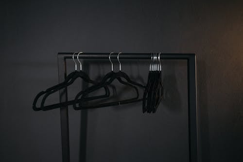 Black Clothes Hangers on a Clothes Rack