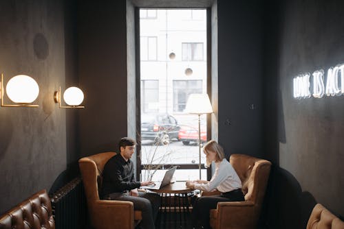 A Man and a Woman Working in the Coffee Shop