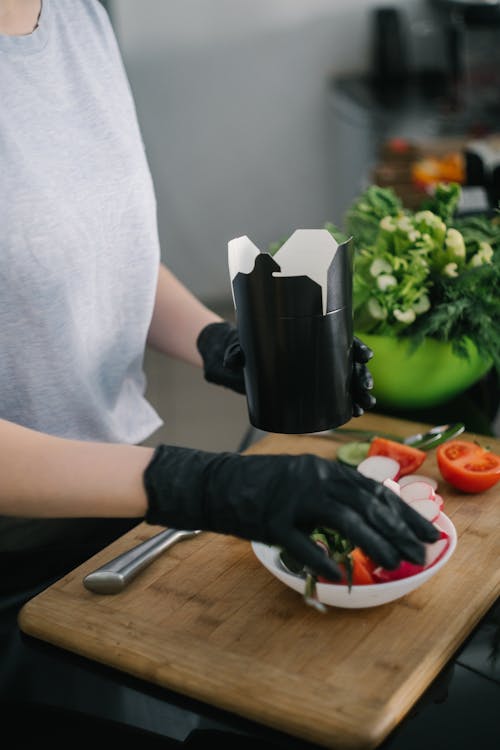 Person Holding Black Ceramic Mug