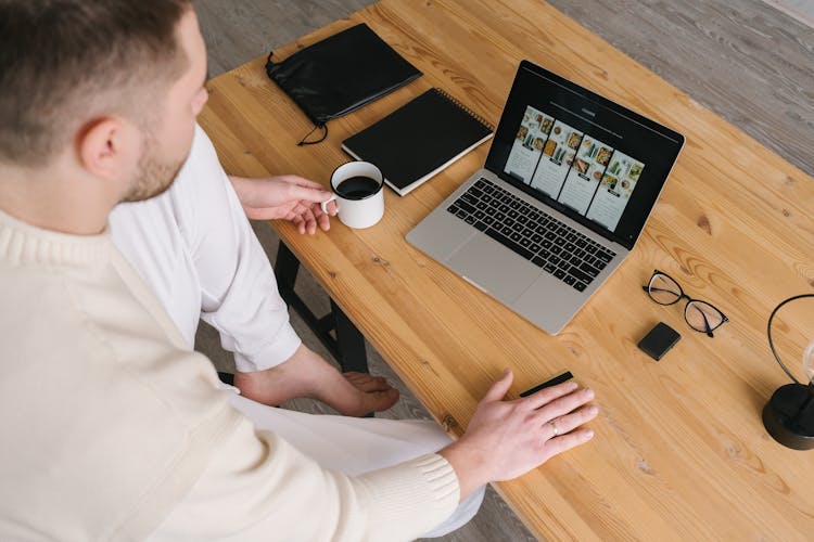 A Man In White Sweater Ordering Online