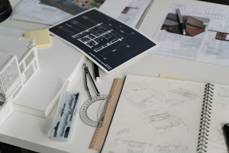 Printed Designs And Drawings Over The Work Table