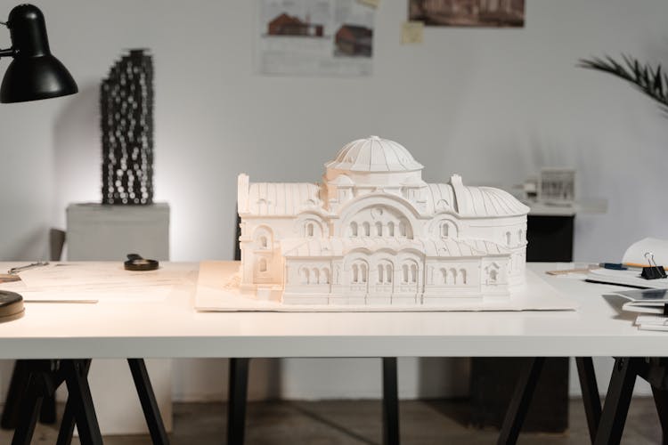 A Model Of A Building On A Table