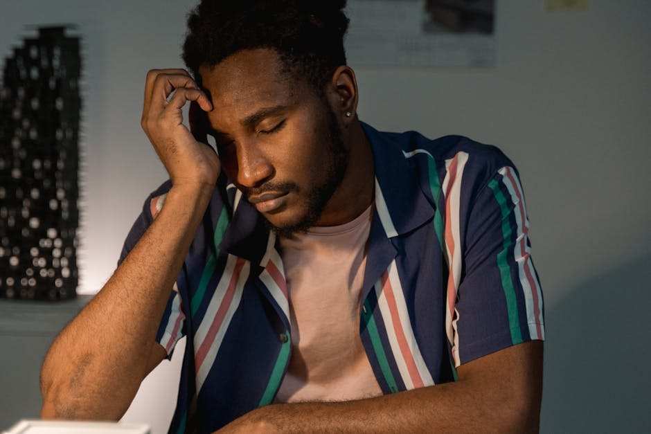 5 Essential Tips for Choosing the Best Foldable Table for Tight Spaces: Simple Solutions for Minimalist Living Person using a compact, foldable table in a small home office with a laptop and notebook