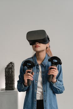 Young woman immersed in a virtual reality experience using a VR headset and controllers indoors.