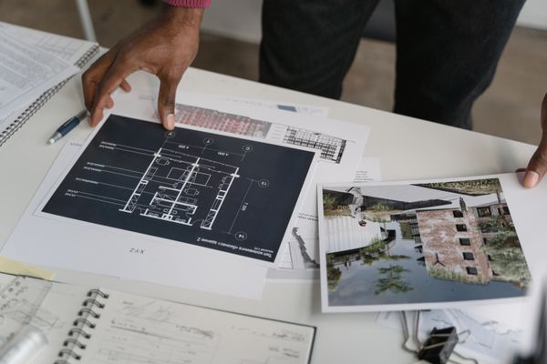 Architect hands reviewing blueprints