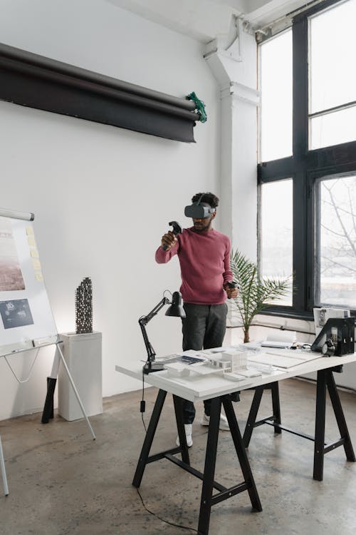 Man with Virtual Reality Headset Playing in the Office