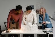 Three People Collaborating on a Project