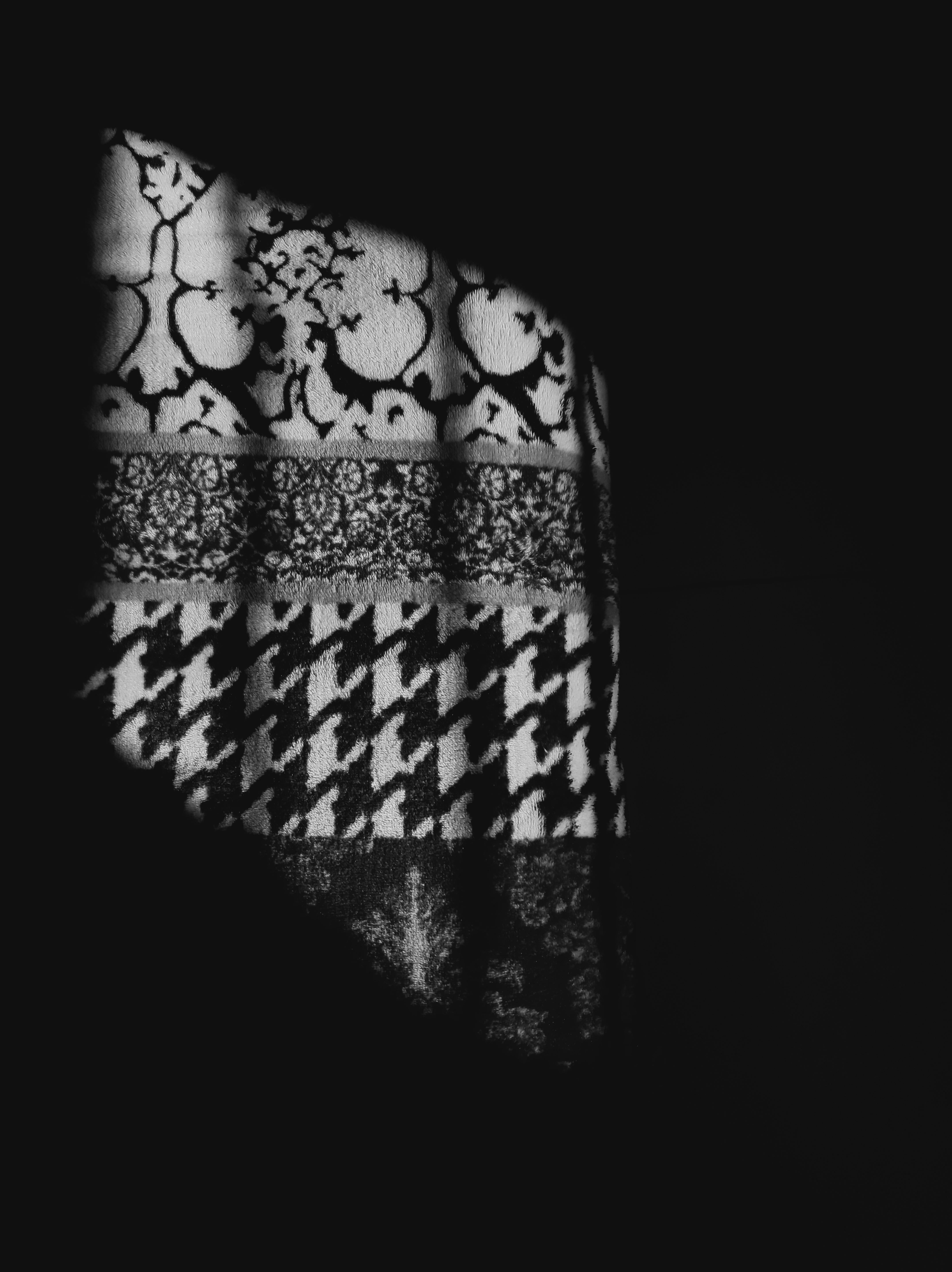 Technician repairing a circuit board with magnifying glass and tools