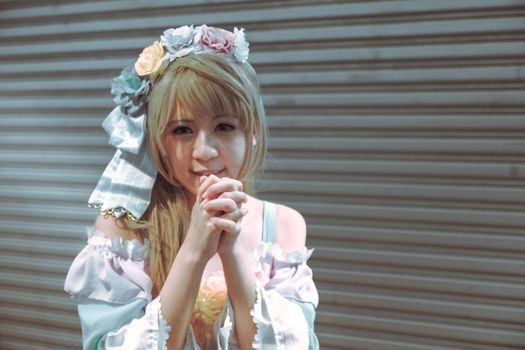 Cosplay portrait of a woman with flower crown, exuding joy and beauty.
