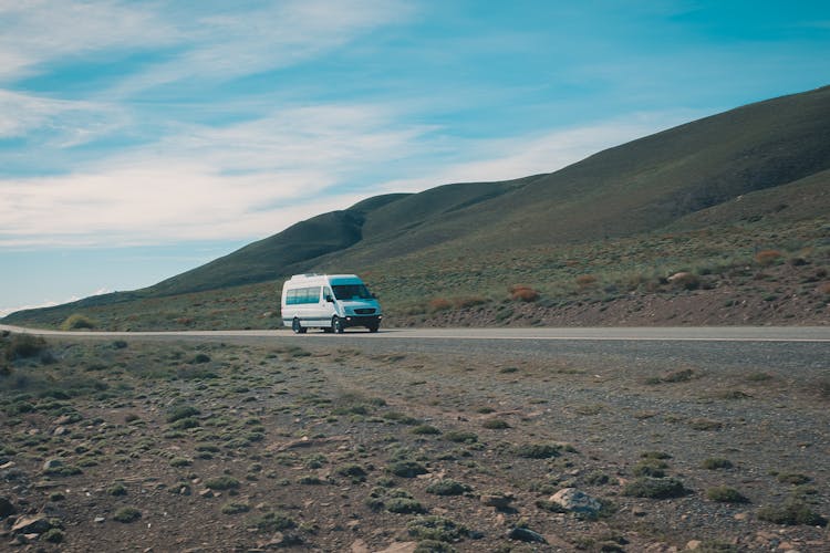 Lone Car On Road Near Mountain