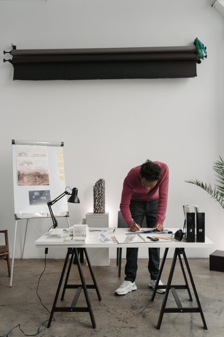 A Man Working Inside An Office