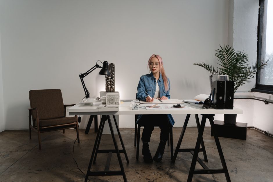 A designer sketching in a bright, modern office - englewood interior designer A designer sketching in a bright, modern office - englewood interior designer