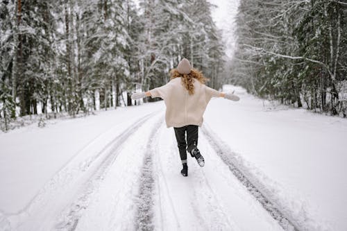 A Woman Running in Winter