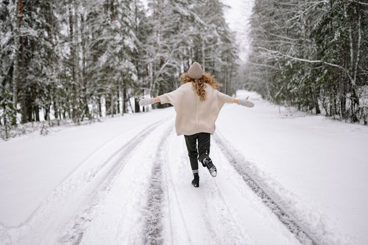 A Woman Running In Winter