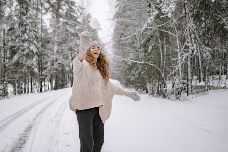 Woman Throwing A Snowball 