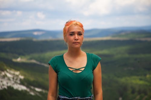 Portrait of Young Woman in a Green Top 