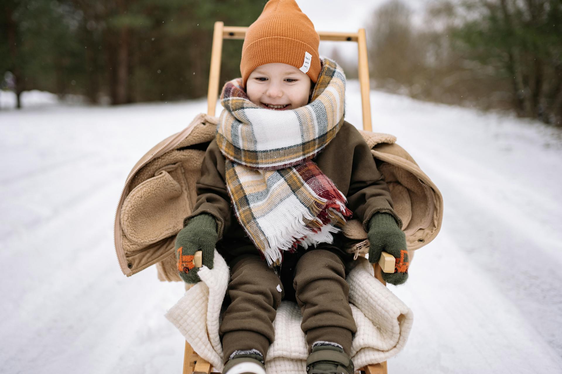 A Boy On a Wooden Sled