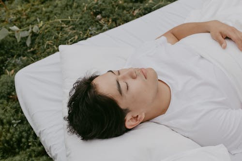 Free Photo of a Man in a White Shirt Sleeping Stock Photo