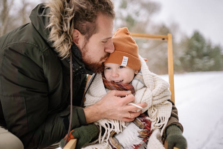 A Father Kissing His Child