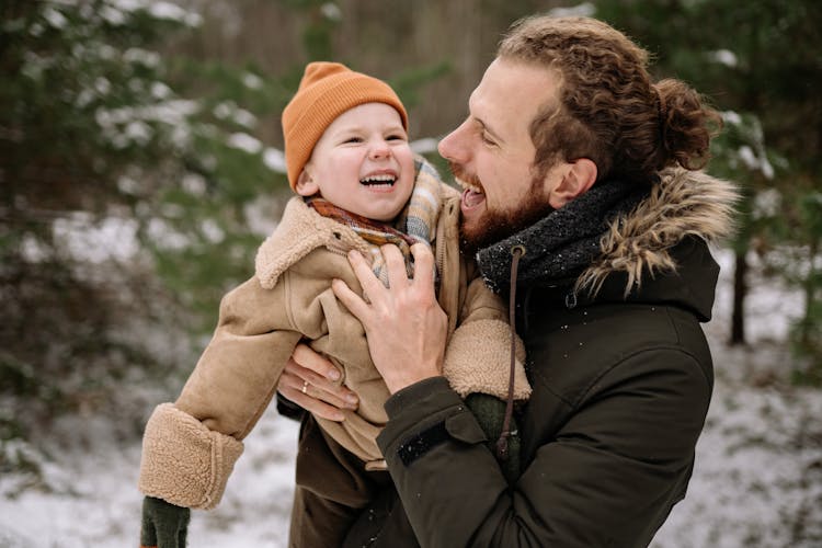 Laughing Man Holding His Son