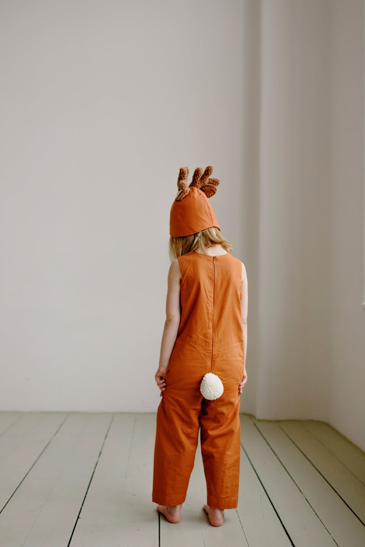 Back View Of A Child In Animal Costume 