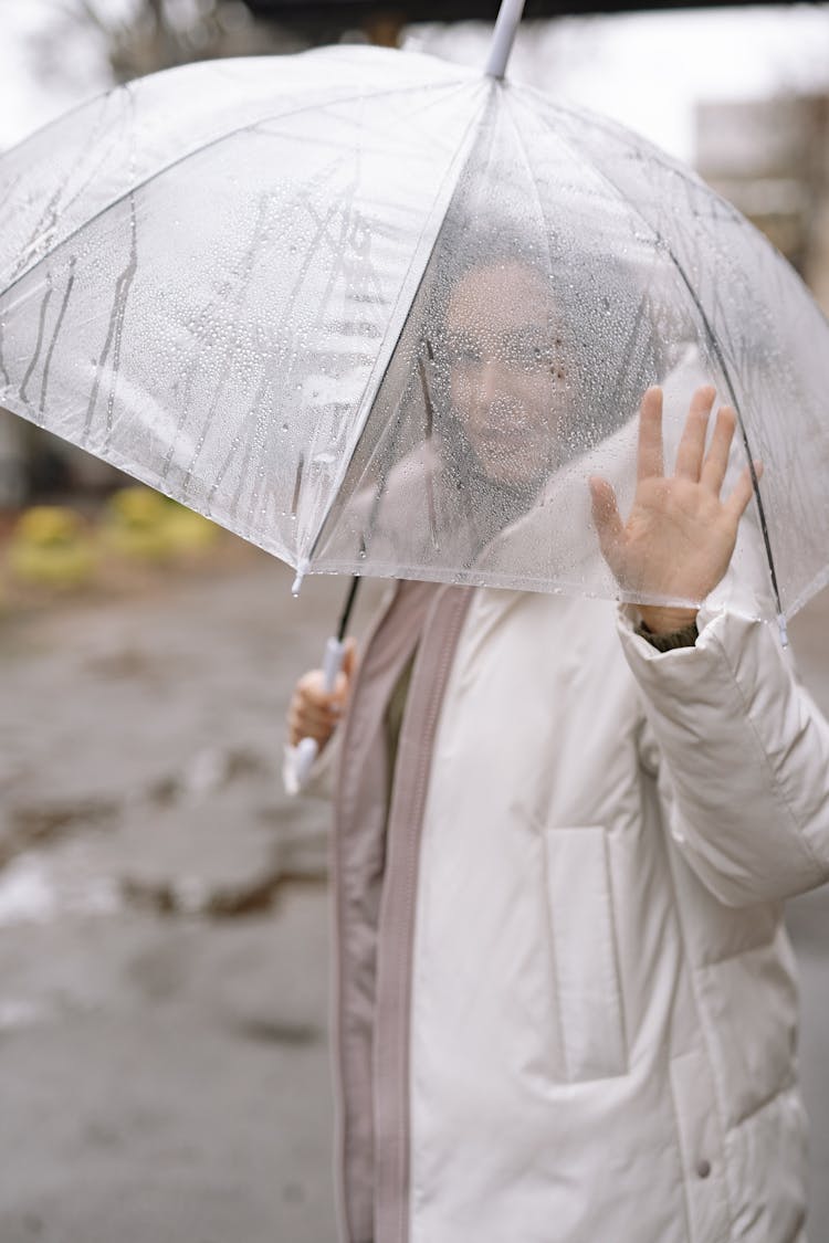 Woman Under Umbrella On Rainy Day