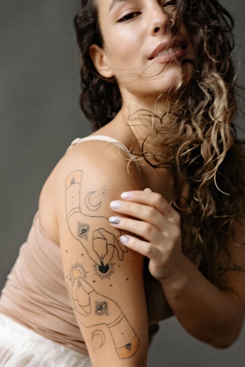 Free A Woman with Arm Tattoo Stock Photo
