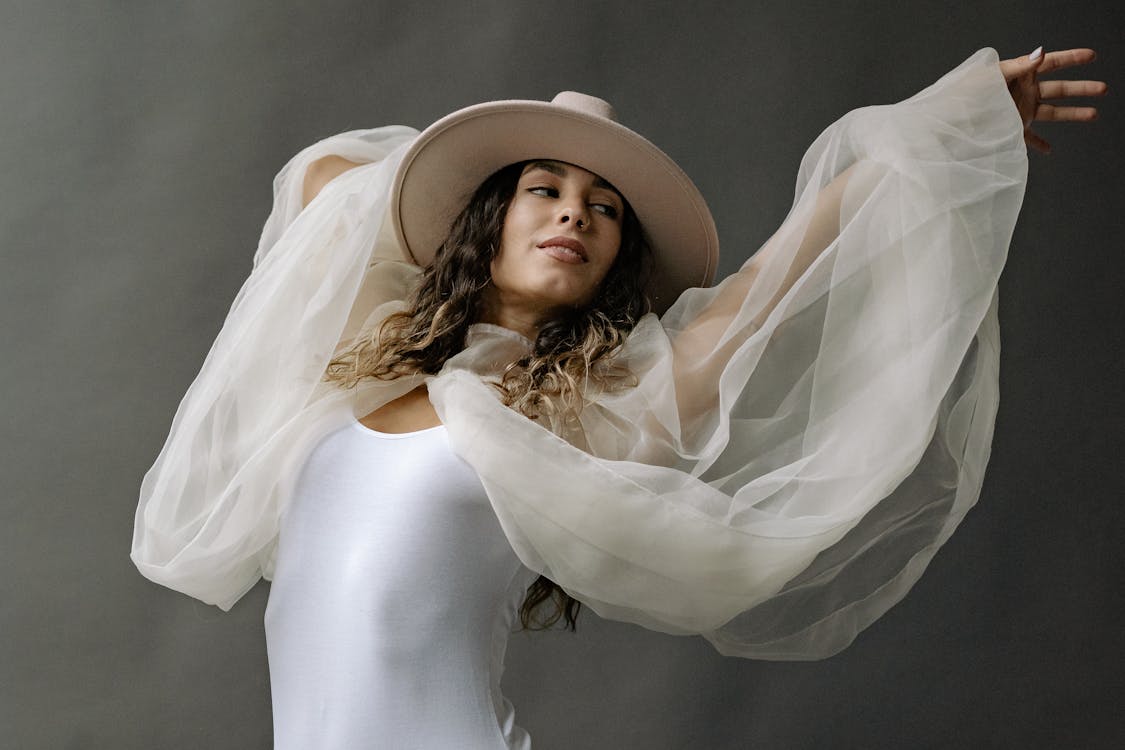 A Woman in a White Tank Top Posing