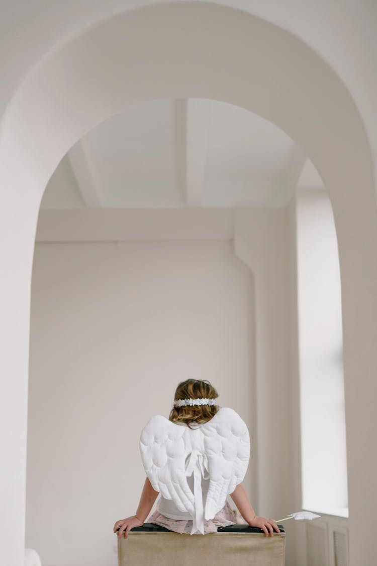 Back View Of A Girl Dressed As An Angel 