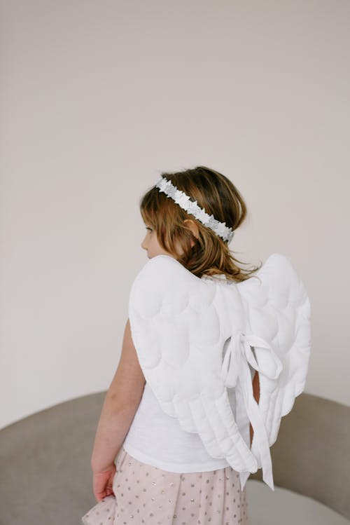 Free A Girl Wearing an Angel Costume and Halo Stock Photo
