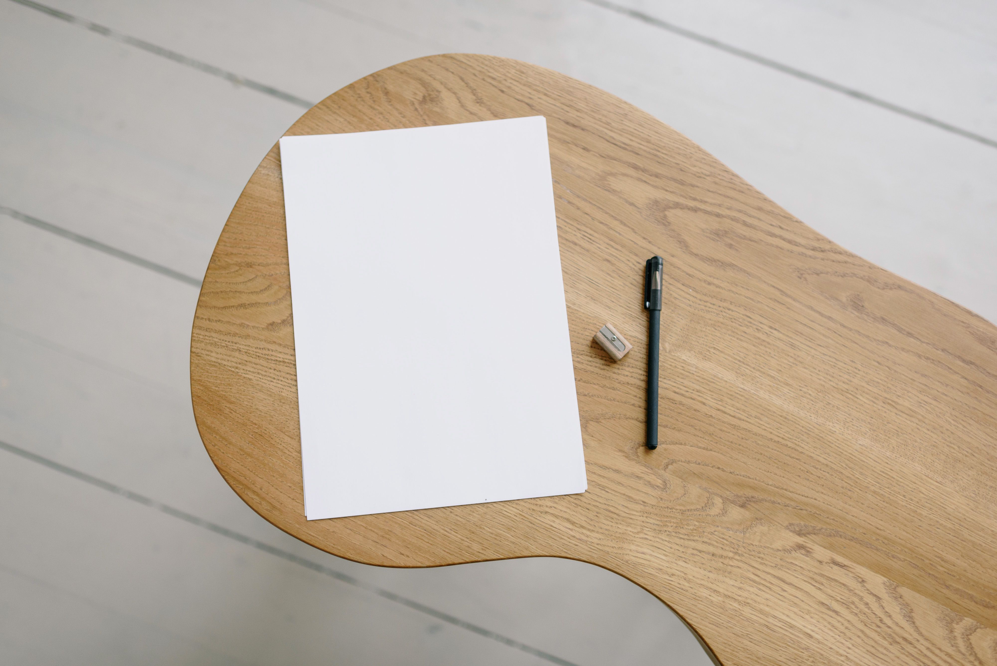 Minimalist Japanese desk with paper and pen in serene office space