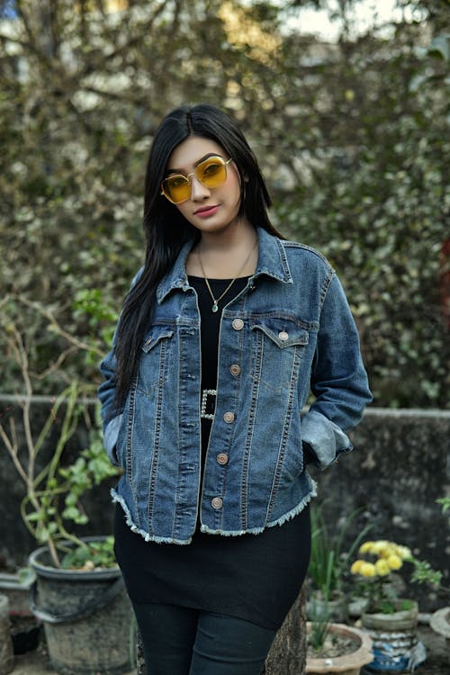 Woman in Blue Denim Jacket and Yellow Sunglasses