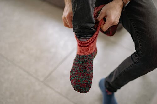Free Man Wearing Warm Knit Socks Stock Photo