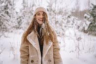A Happy Woman Covered in Snow