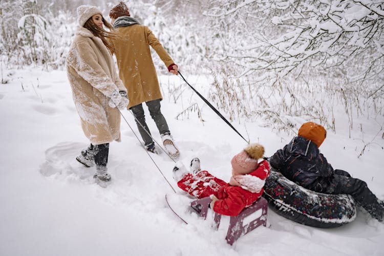 Couple Taking Their Children Sledding