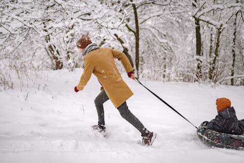 Father and Son Playing in Snow