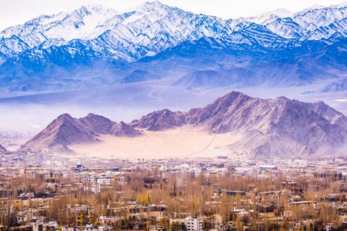 Free Breathtaking aerial view of Leh in Ladakh, India, surrounded by majestic snow-capped mountains. Stock Photo