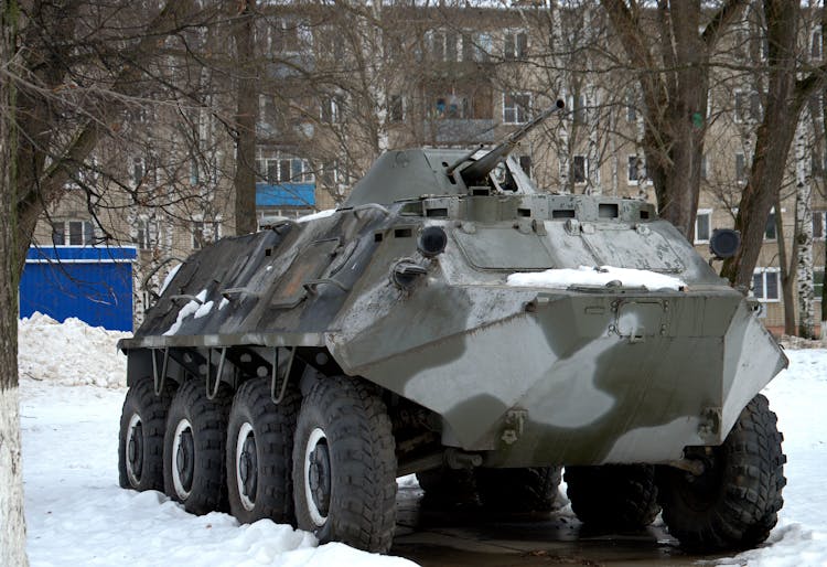 Military Tank Parked In Snow