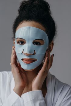 Calm woman enjoying a skincare routine with a revitalizing face mask.