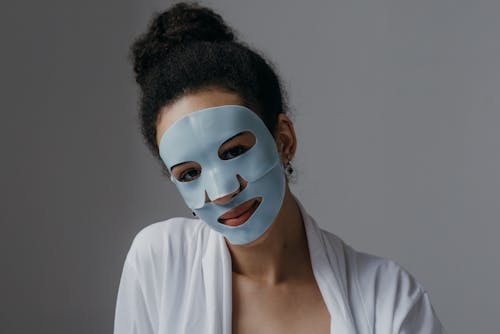 Free Woman with Facial Mask while Looking at Camera Stock Photo