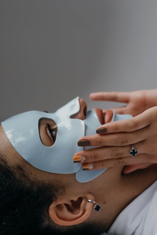 Free Woman Using a Facial Mask Stock Photo