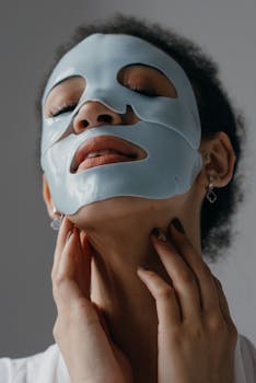 Close-up of a woman with a hydrating sheet mask emphasizing skincare and beauty.