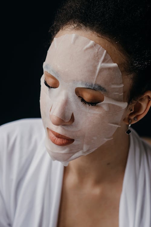 Close-Up Photo of a Woman with Facial Mask