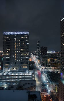 Beautiful nighttime view of Baltimore, Maryland, showcasing city lights and skyscrapers under a dark sky.